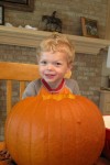 Our pumpkin carves his first pumpkin