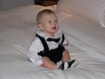 Collin in tuxedo on the bed
