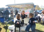 The golf cart is perfect tailgating for Collin, JT and Rachel Depke