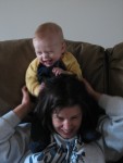 Sitting on Mommy's shoulders